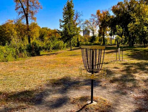 A disc golf basket on a course in North Dakota